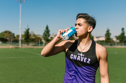 Close-up Photo of Man drinking Beverage 