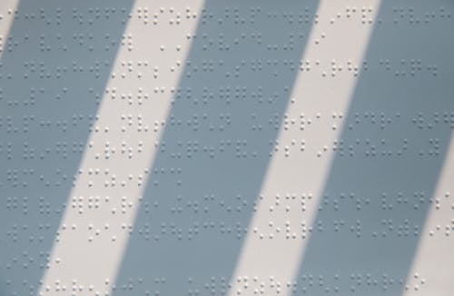 Close-Up Photo of Braille Characters
