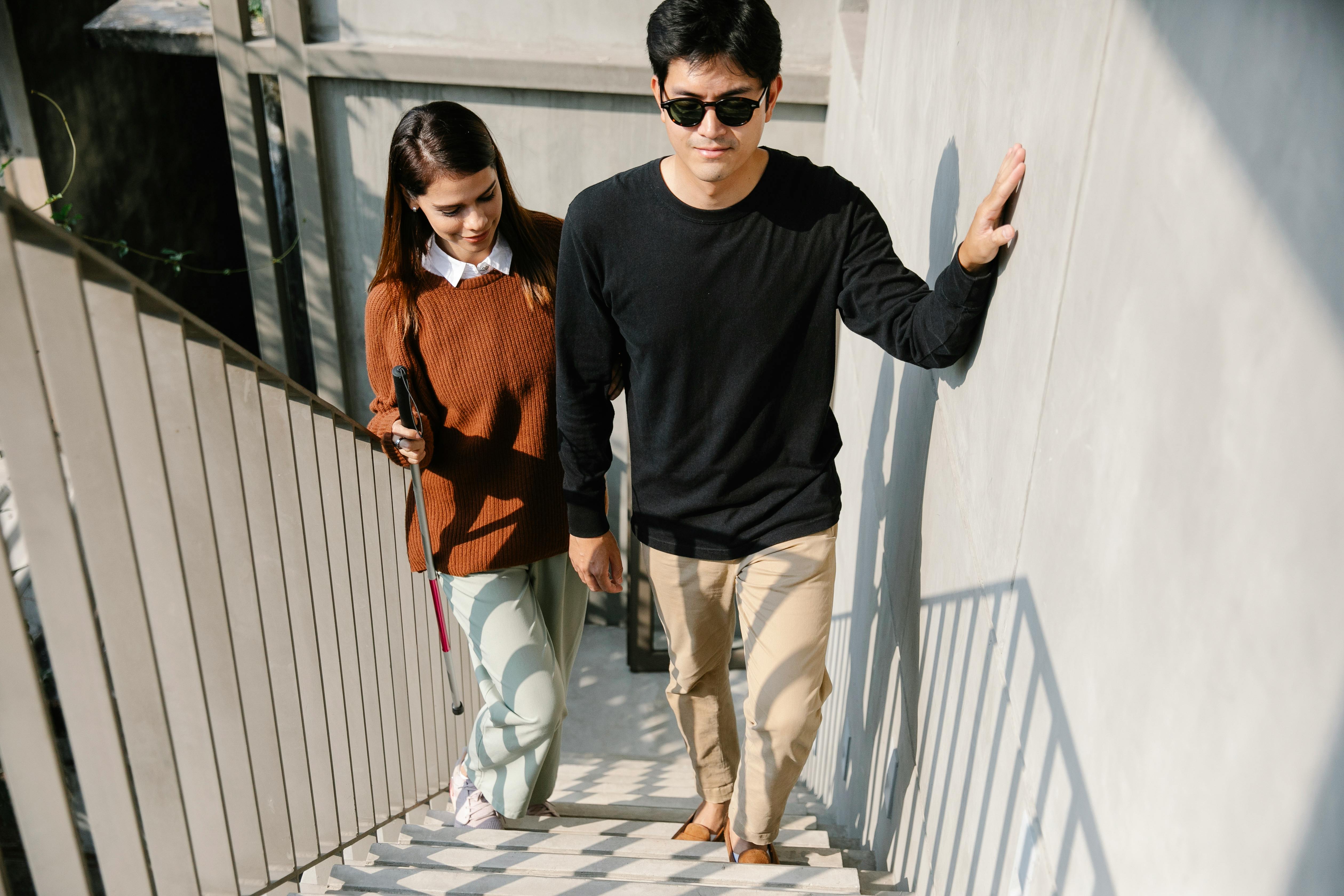 photo of woman happily assisting man