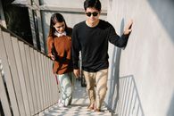 Photo of Woman Happily Assisting Man