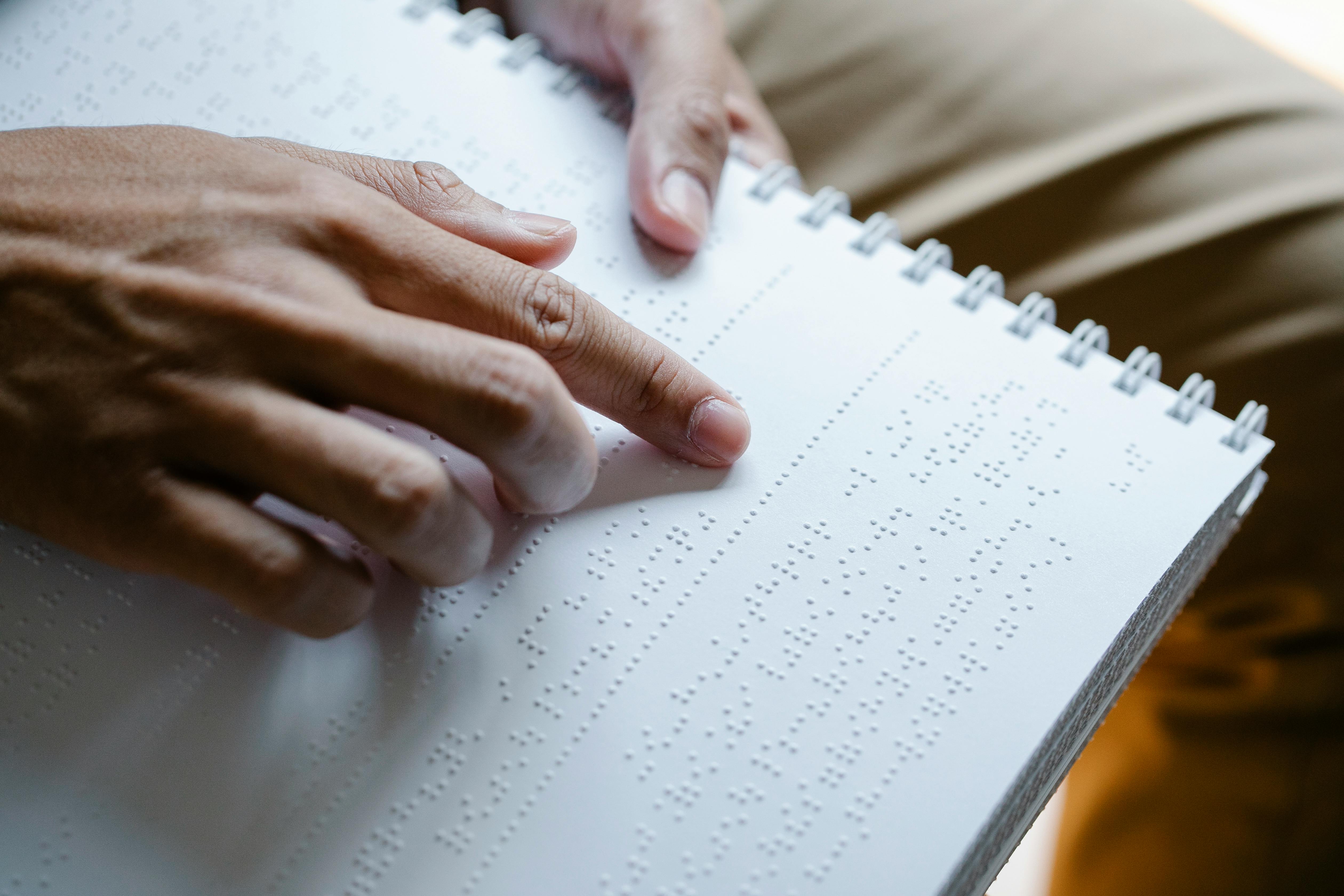 photo of person using braille