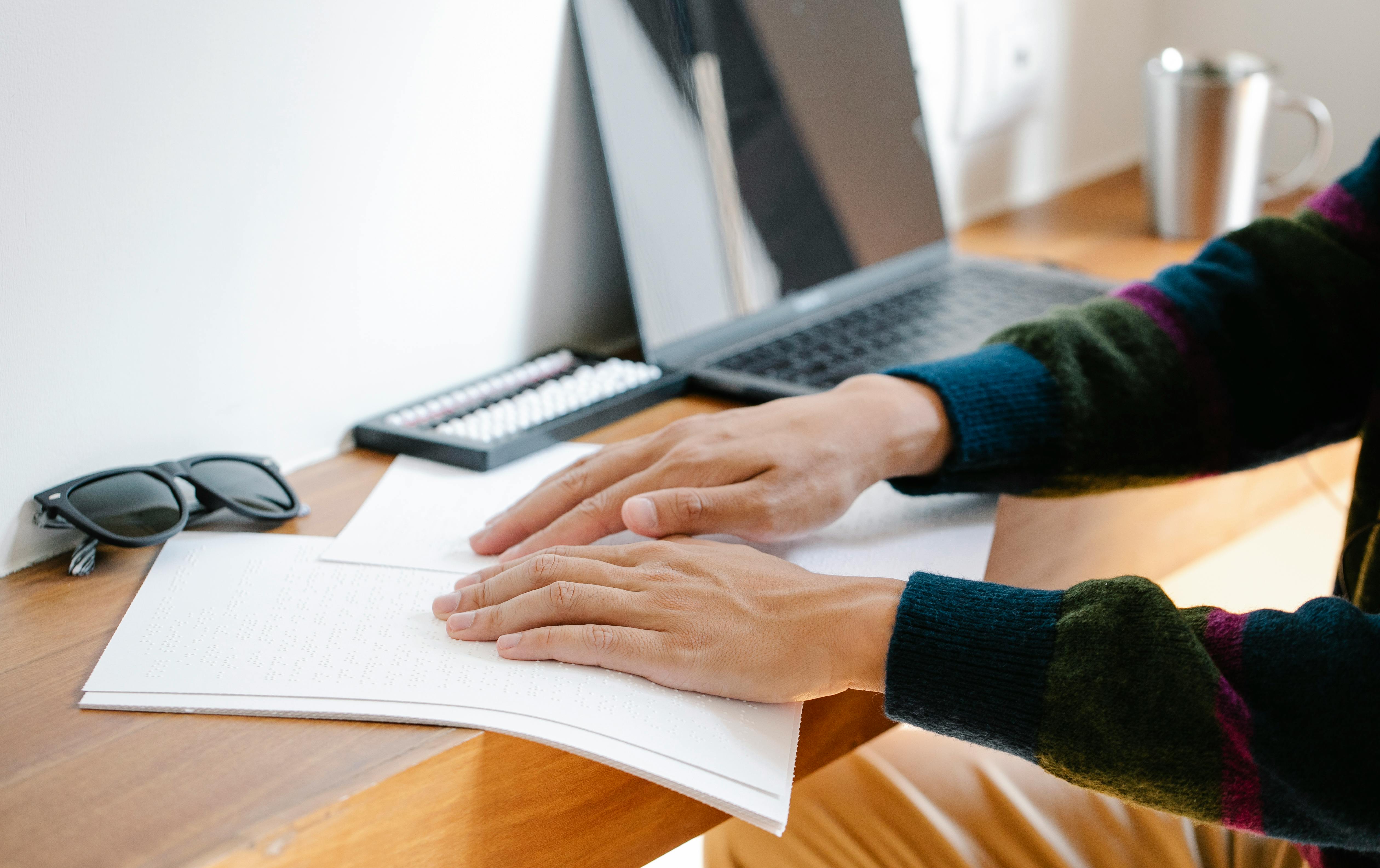 photo of person using braille