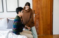 Photo of Woman Assisting Man
