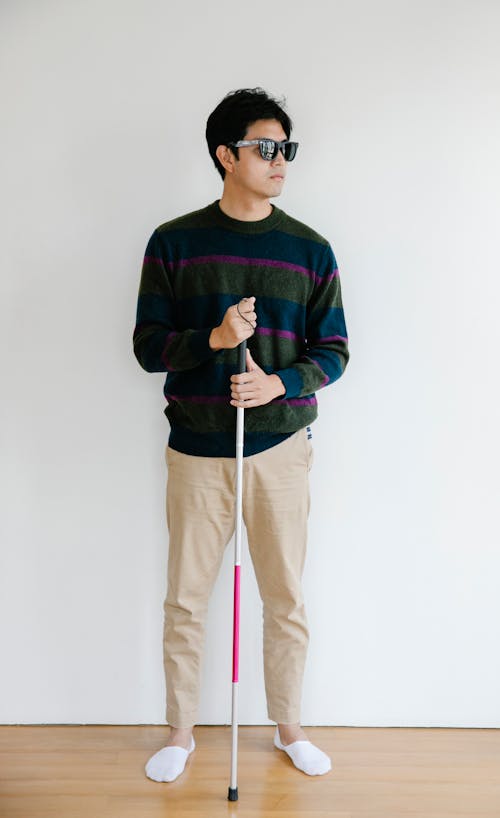 Photo of Man Holding Walking Stick