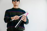 Photo of Man Dismantling Cane