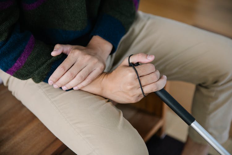 Photo Of Man Holding His Arm 