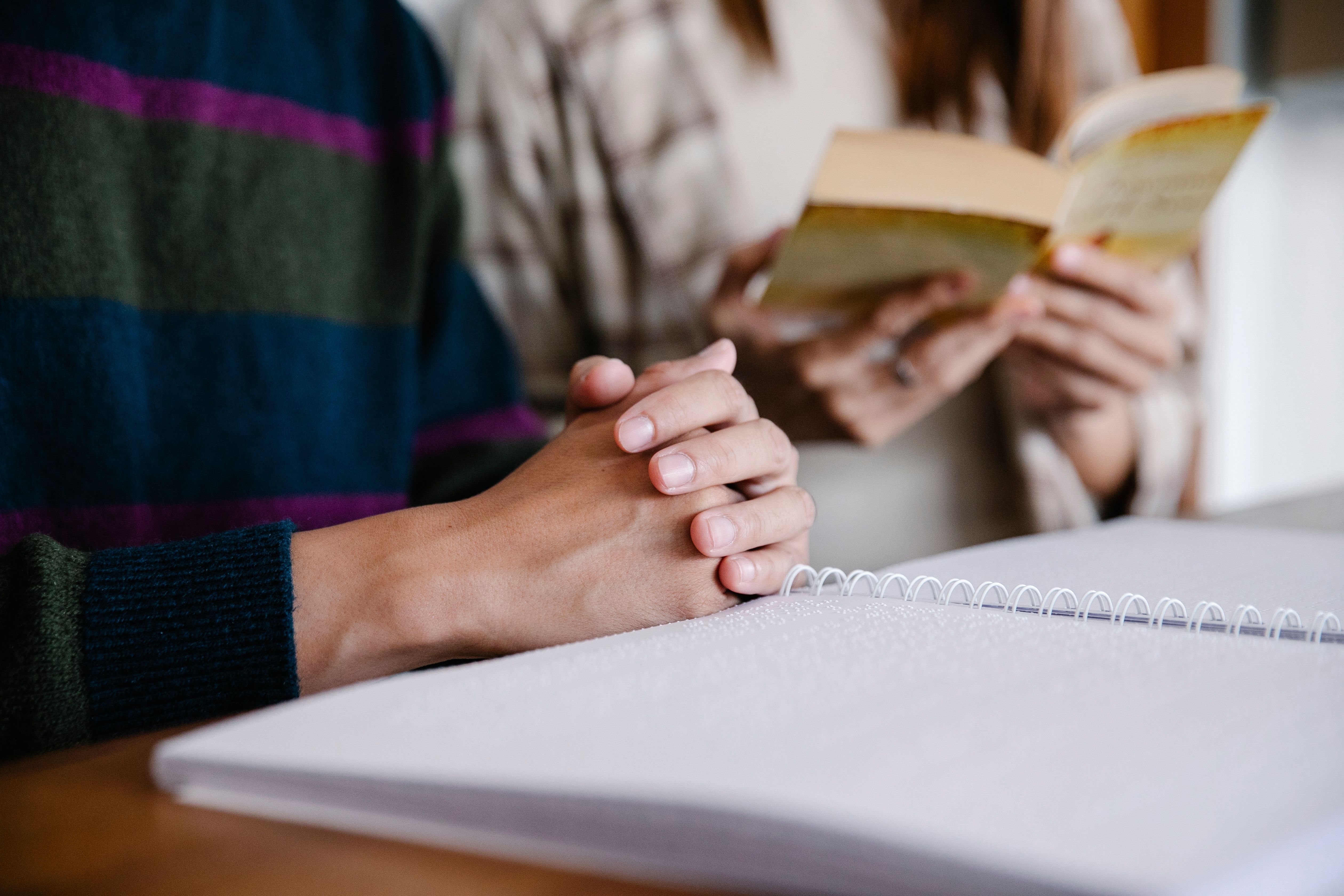 Close-Up Photo of Person Holding Book · Free Stock Photo