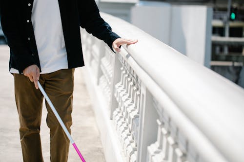 Free Photo Of Man Walking On Sidewalk Stock Photo