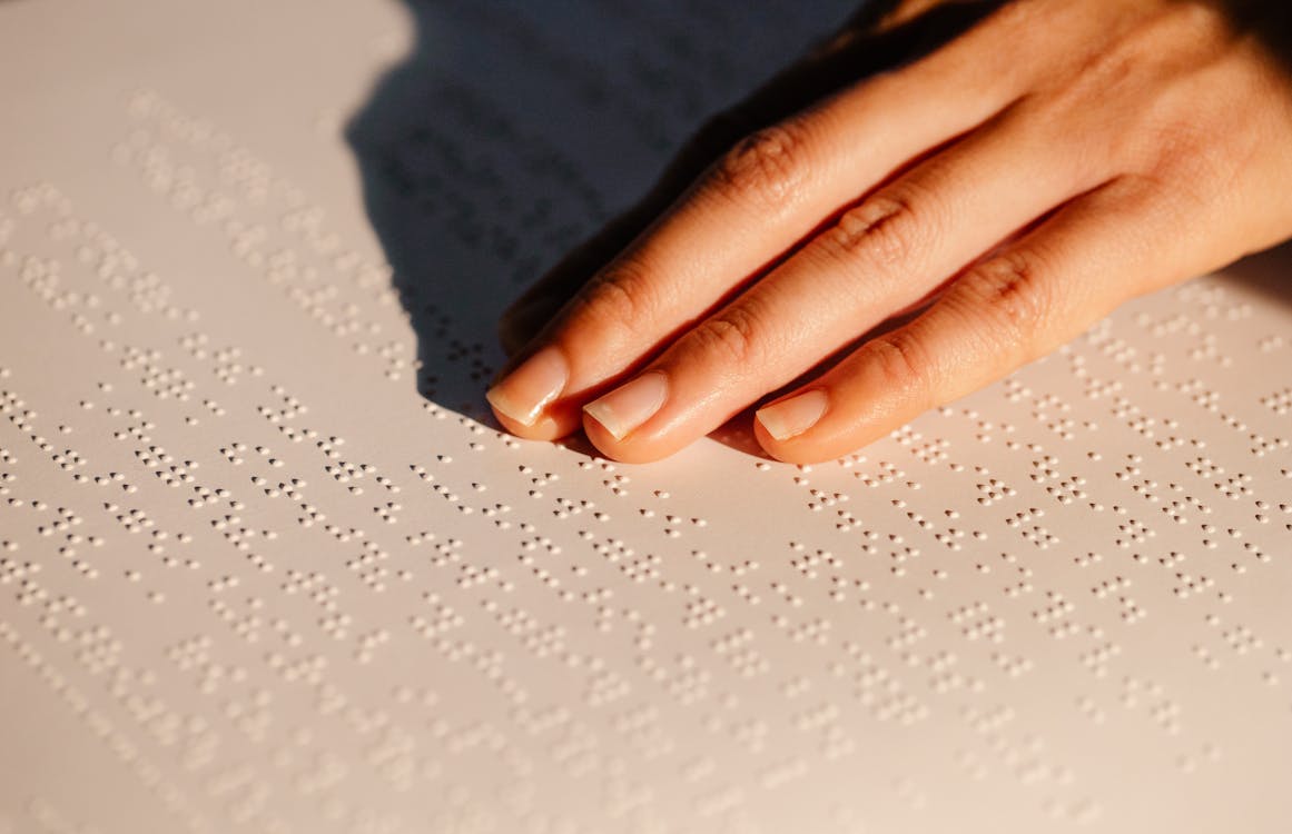 Free Close-Up Photo Of Person Using Braille  Stock Photo