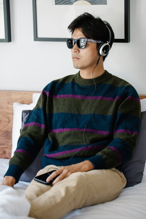 Photo of Man Listening to Music