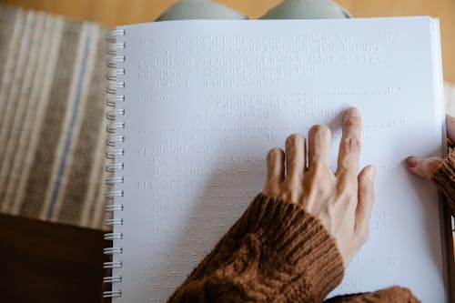 Free Photo of Person Using White Braille Paper Stock Photo