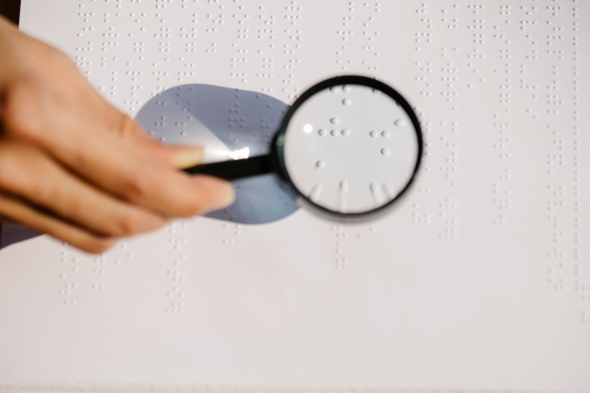 A magnifying glass held over a printed page, used here as a picture of checking for what is actually there