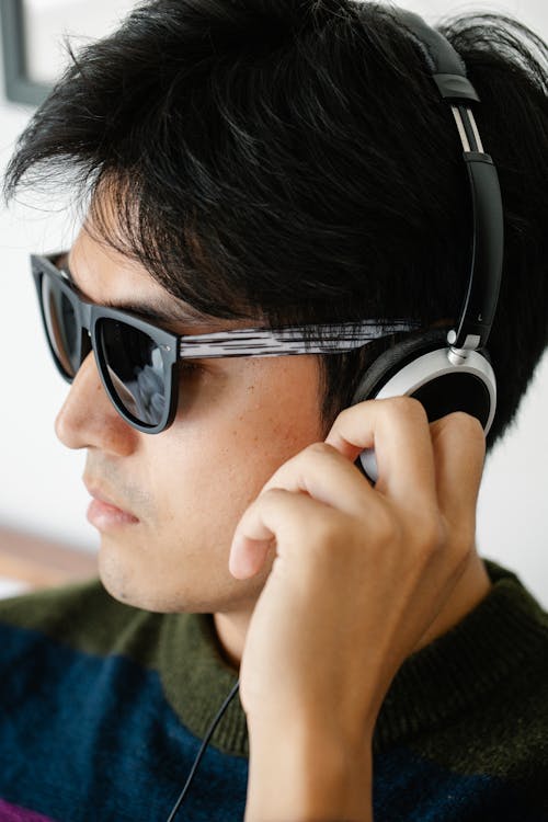 Close-Up Photo of Man Using Headphones