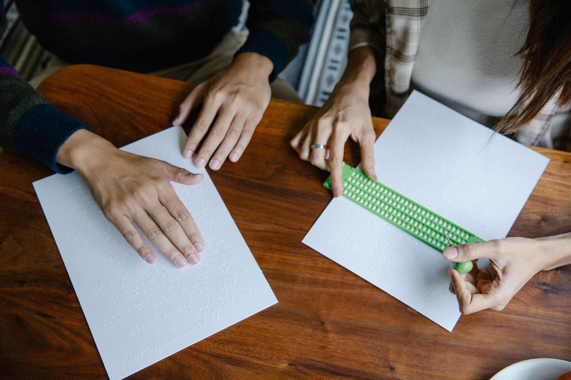 Photo of Person Holding Slate and Stylus