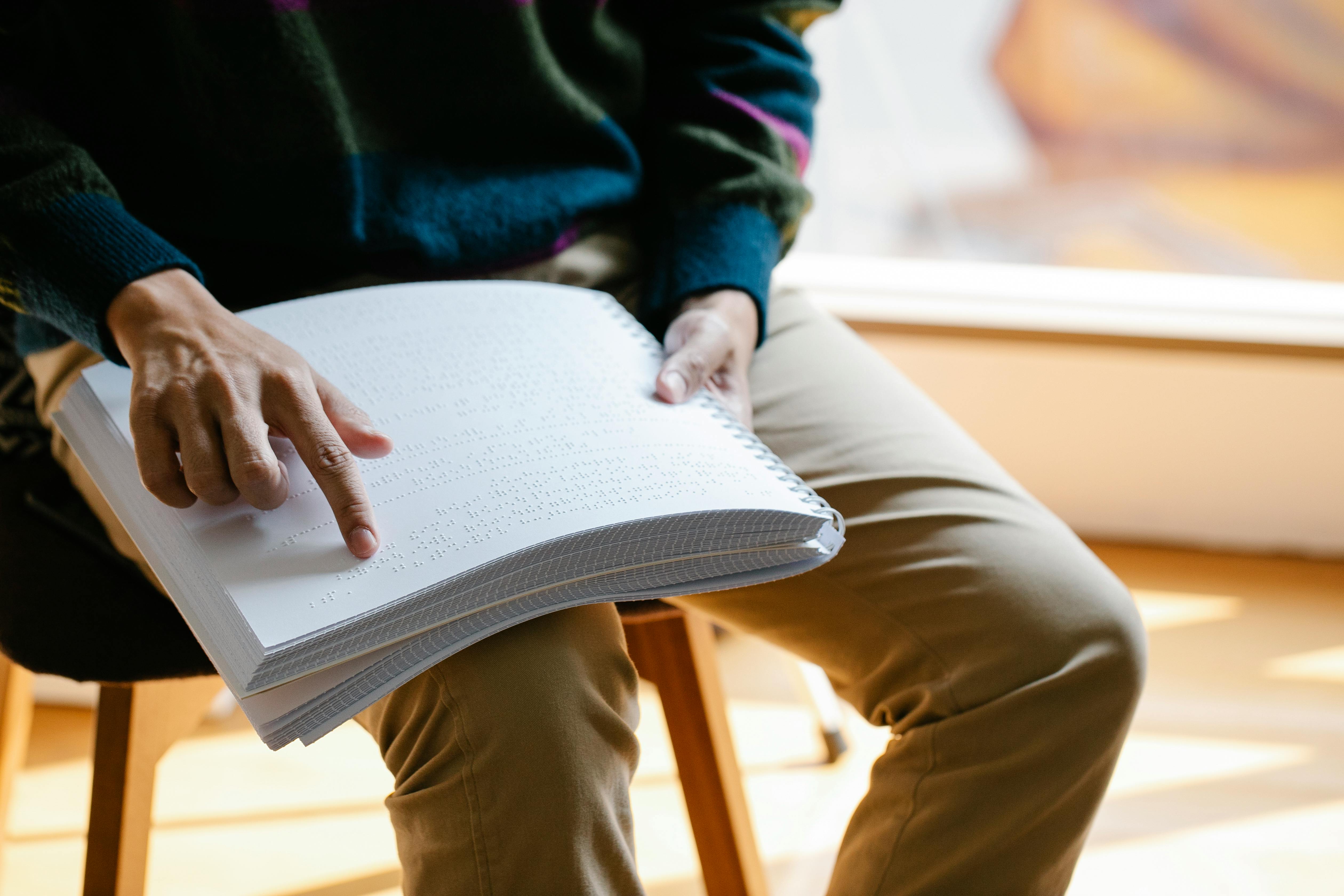 photo of person learning braille