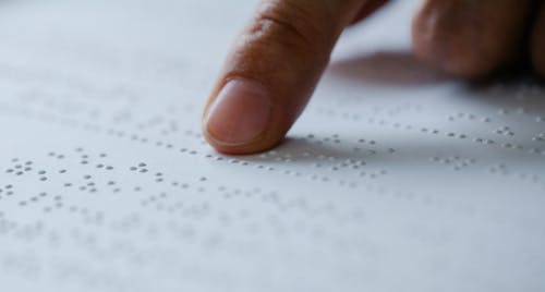 Free Photo of Person Pointing on Braille Stock Photo