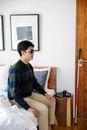 Photo of Man Sitting on the Bedside