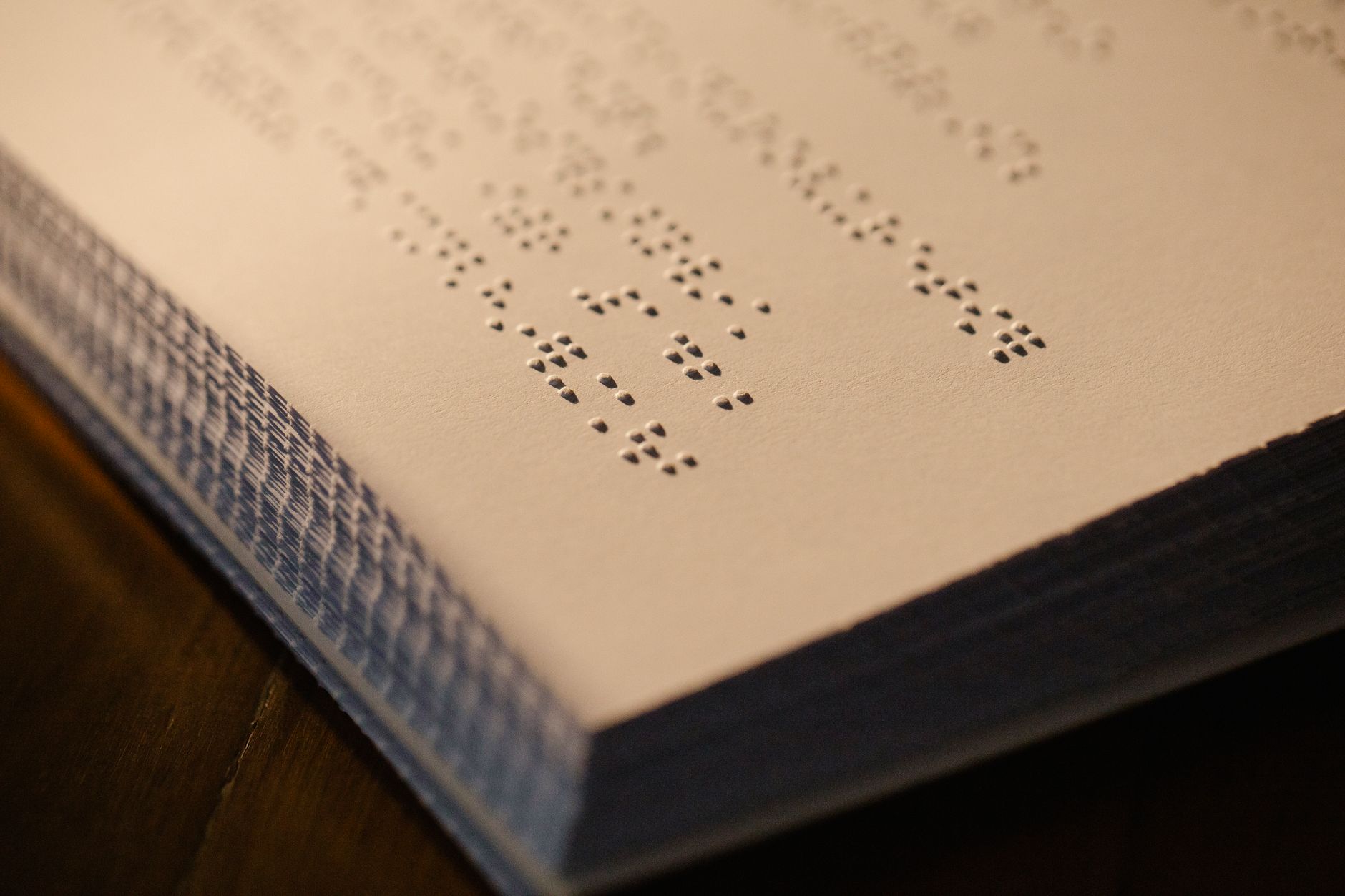 Close-up of printed betting terms with highlighted withdrawal limits and calculator, investigative desk setting