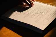 Close-Up Photo of Person Using Braille