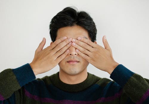 Free Photo of Man Covering his Eyes Using Hands Stock Photo