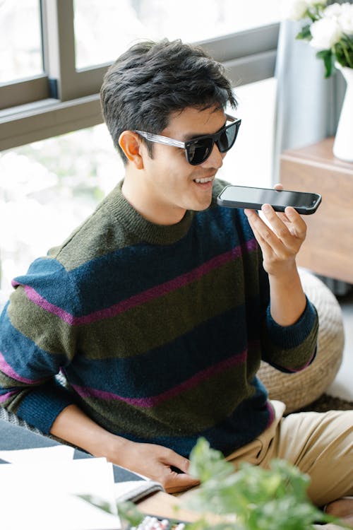 Photo of Man in Casual Oufit Talking to the Phone