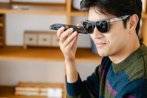 Free Photo of Man Listening Closely on his Mobile Phone Stock Photo