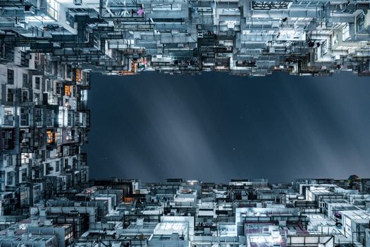 A stunning night view of densely packed skyscrapers creating an enclosed urban frame.