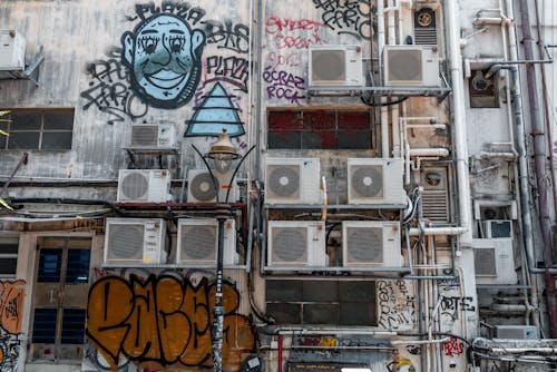 Wall with Graffiti and Air Conditioners