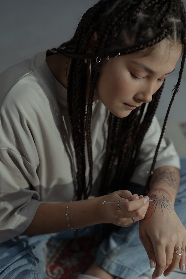 Woman Applying Henna Tattoo