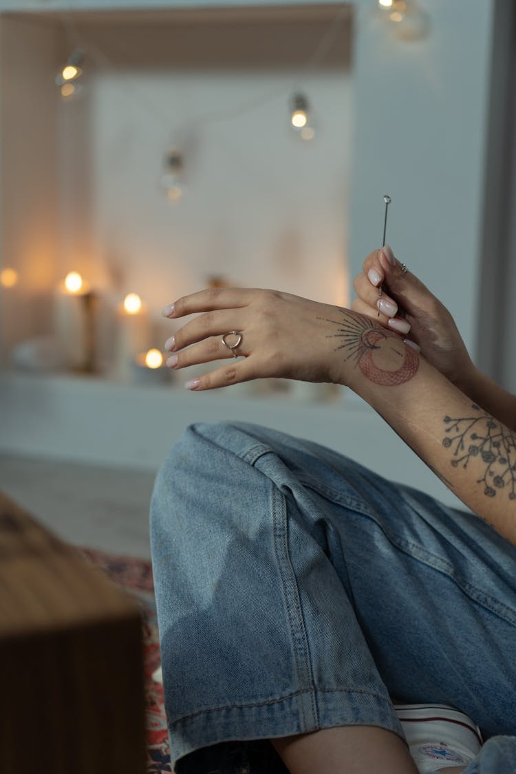 Woman Making Handpoke Tattoo With A Needle