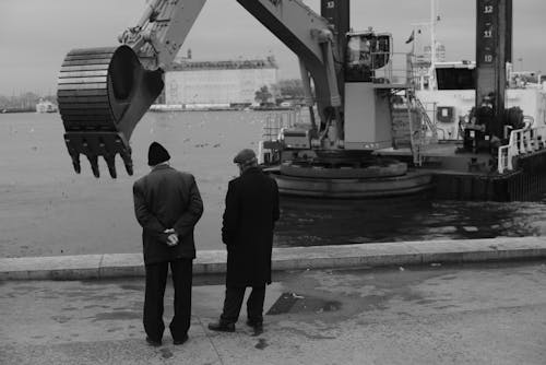 Men Watching an Heavy Machinery