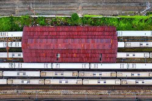 Free An aerial view showcasing commuter trains and tracks at a Jakarta railway yard. Stock Photo