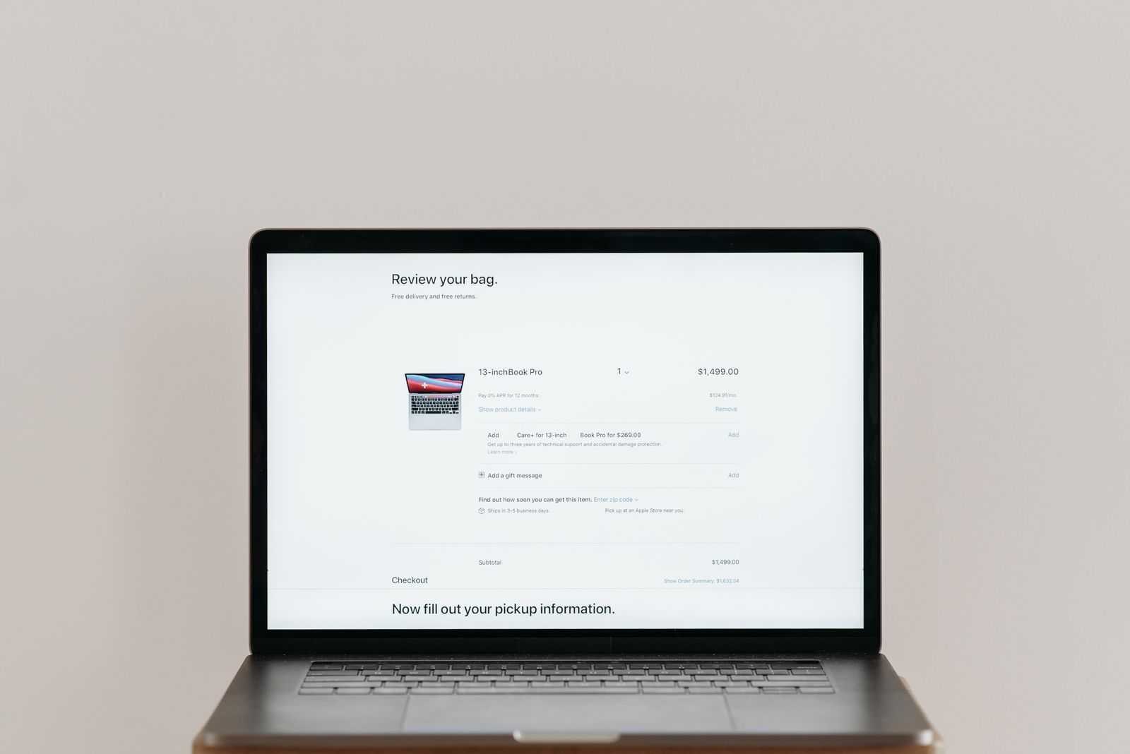 Minimalist laptop screen showing an online checkout page with itemized pricing