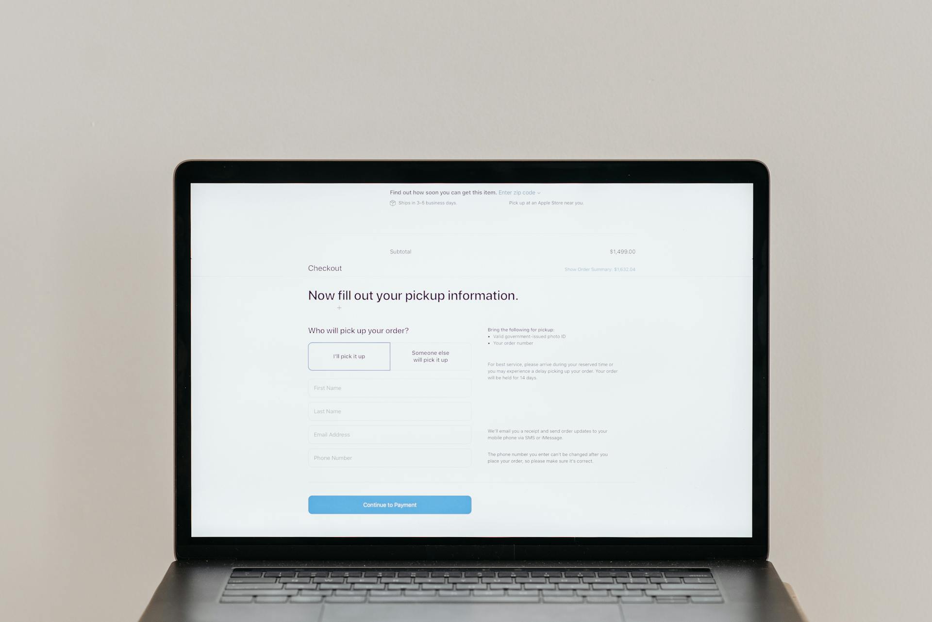 A laptop displaying an online checkout form, highlighting technology and e-commerce.