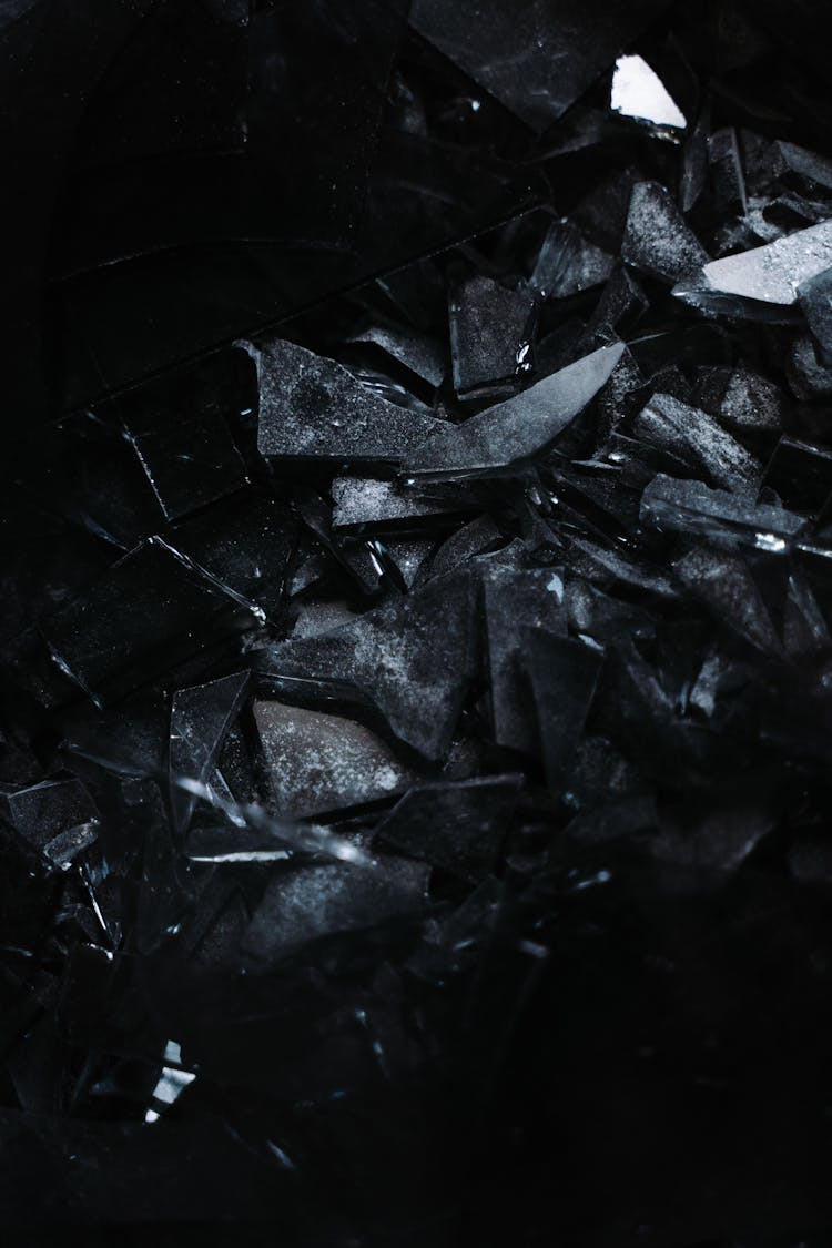 Fragments Of Broken Glass On A Black Surface