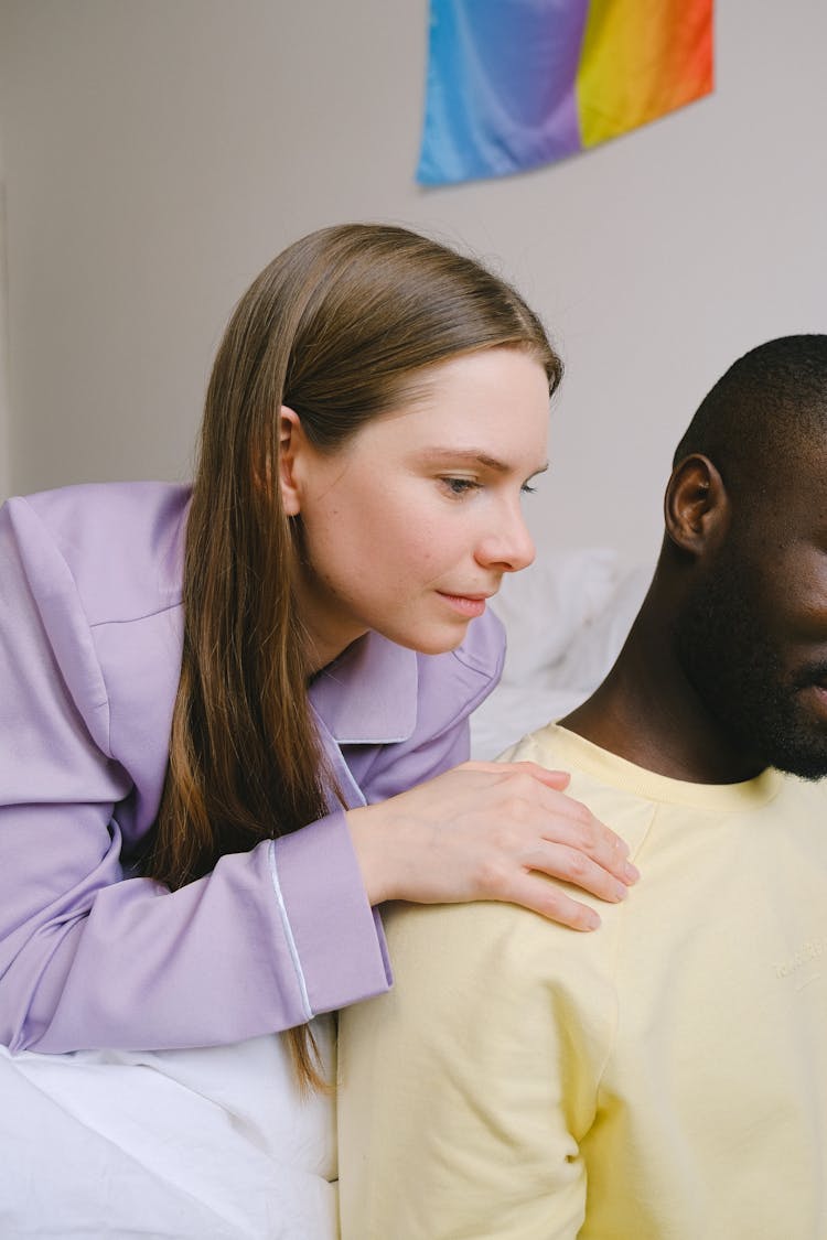 Woman Touching A Man's Shoulder