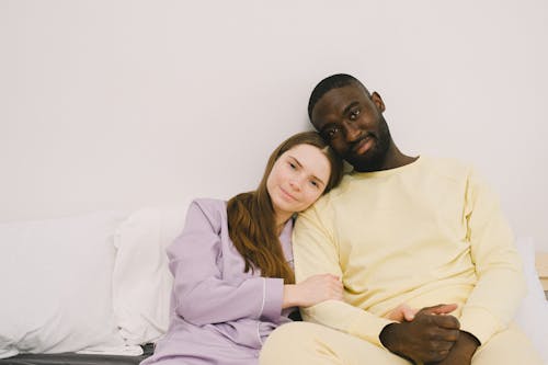 Free Couple in Pajamas Smiling at the Camera Stock Photo