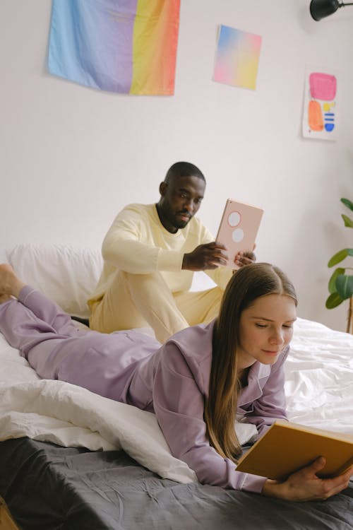 Couple in Pajamas Lying on the Bed