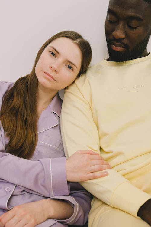 Free Woman Leaning on Man's Shoulder Stock Photo
