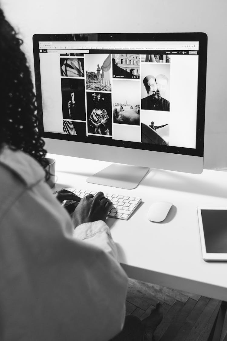 Black Woman Typing On Keyboard Of Modern Computer