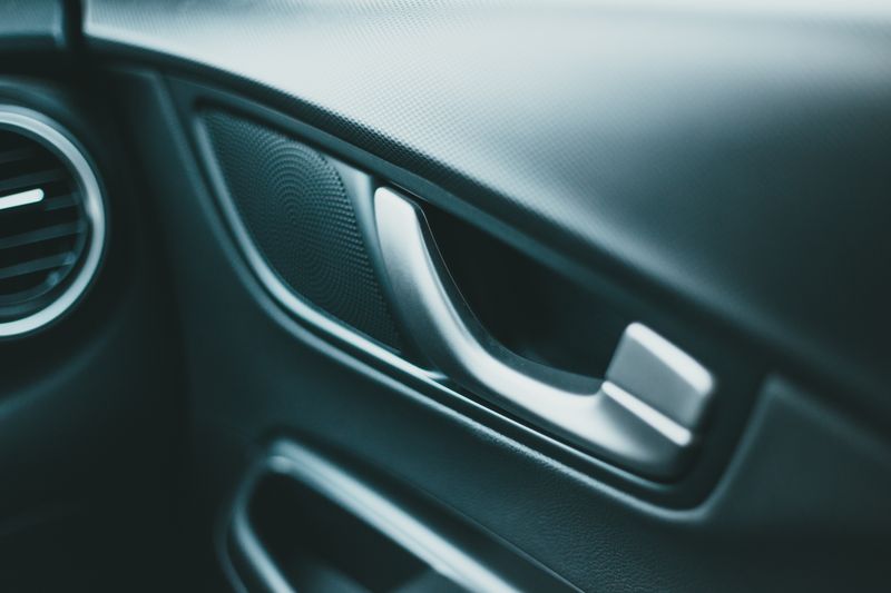 Interior door panel and handle of the car — photo by Erik Mclean on Pexels