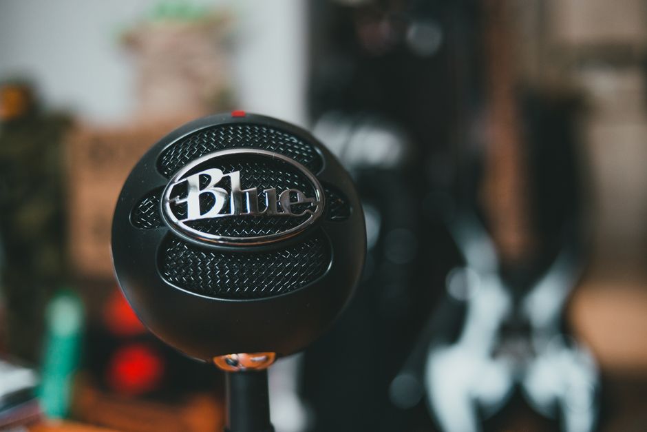 A Blue microphone captured in shallow focus with a blurred background, ideal for audio recording themes.