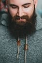 Bearded man in warm gray hoodie