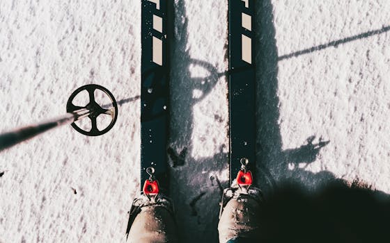 View of ski equipment on snowy terrain, highlighting a winter adventure in Poland.