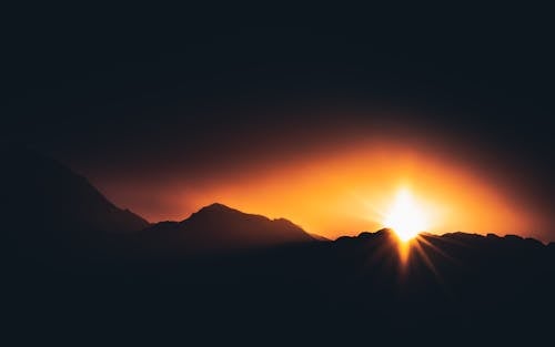 Silhouette of Mountains During Sunset