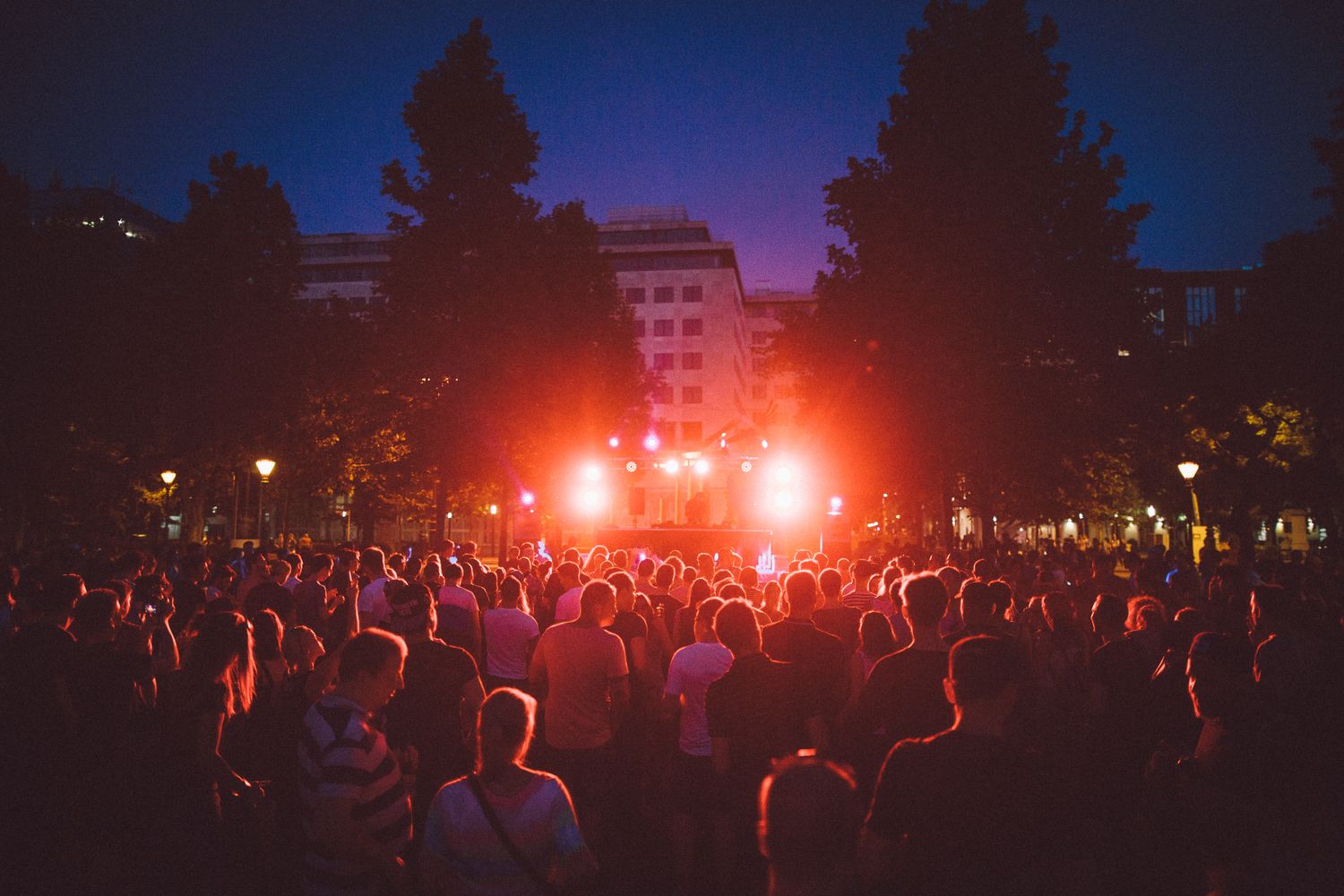Audience immersed in a colorful live event