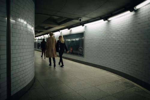 People Walking in a Underground Tunnel