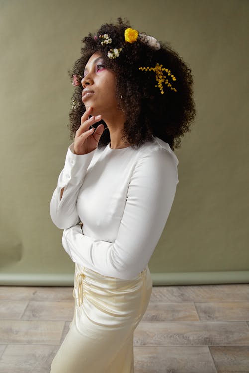 Free An Afro-Haired Woman in White Top Posing Stock Photo
