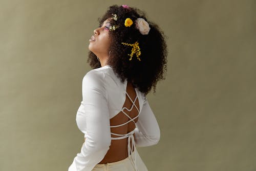 Free An Afro-Haired Woman in White Top Posing Stock Photo