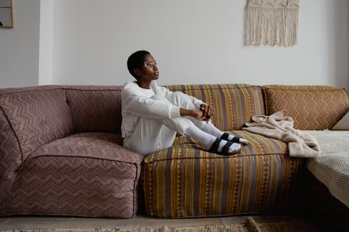 A Woman Sitting on the Sofa